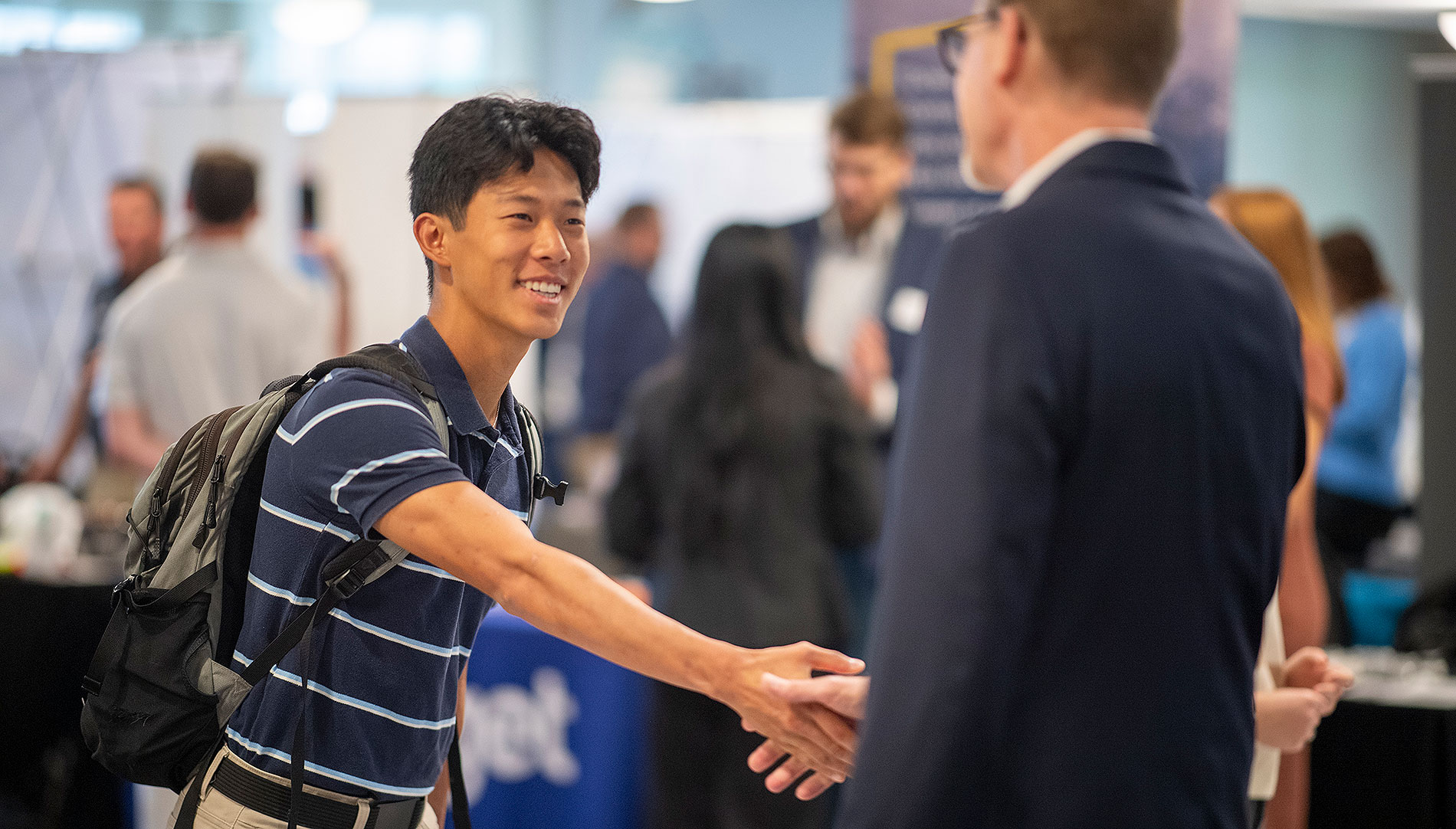 Shaking hands at a job fair