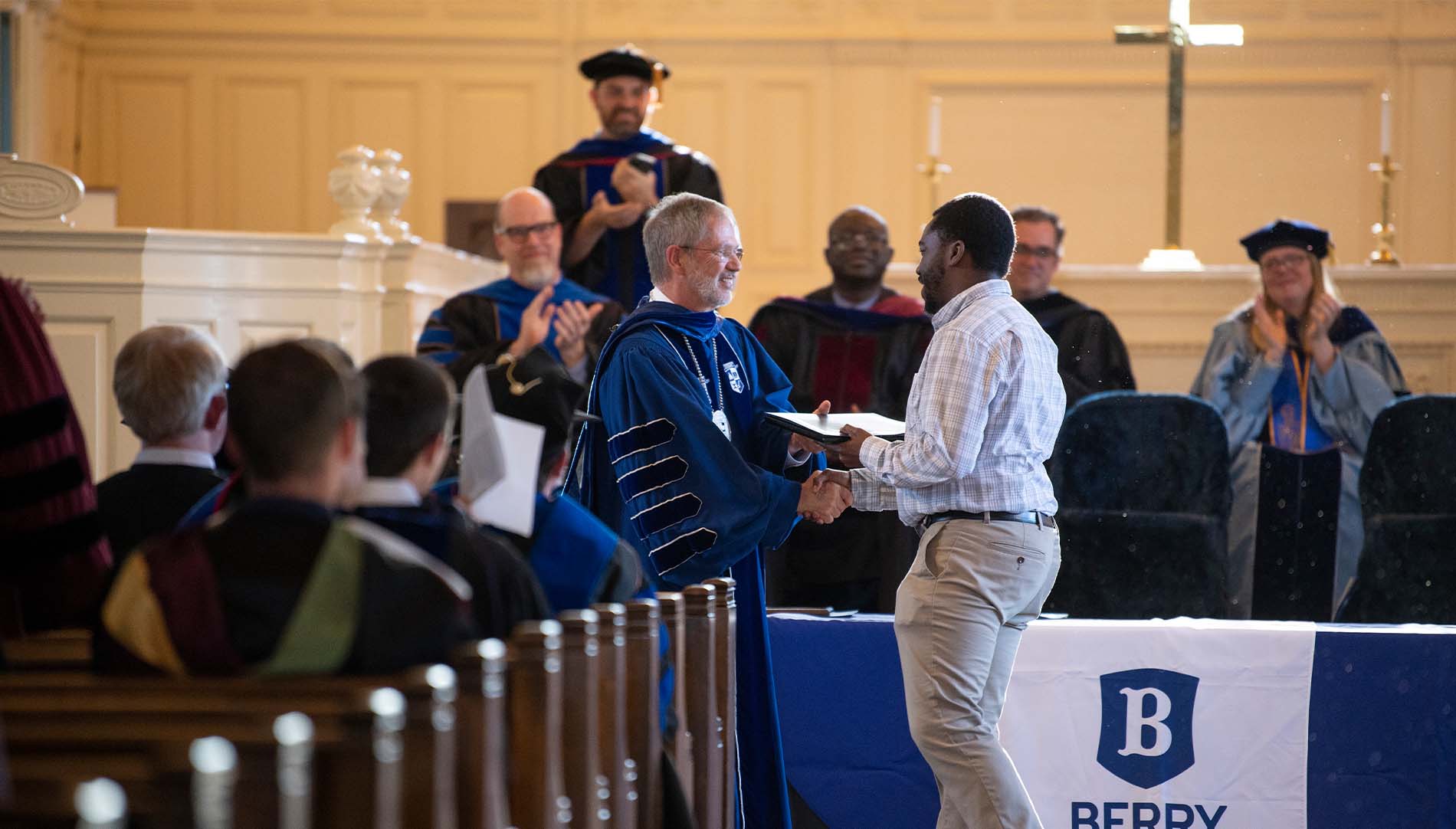 Steve Briggs presents staff with award
