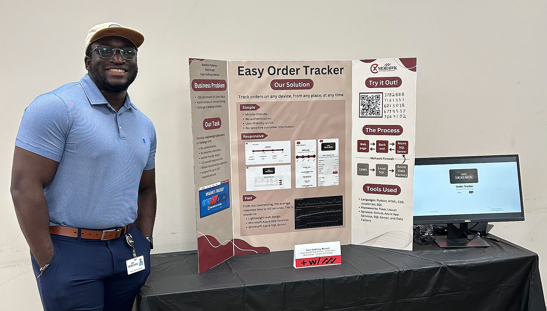 Sean-Anthony Mensah giving a poster presentation during his internship at Mohawk