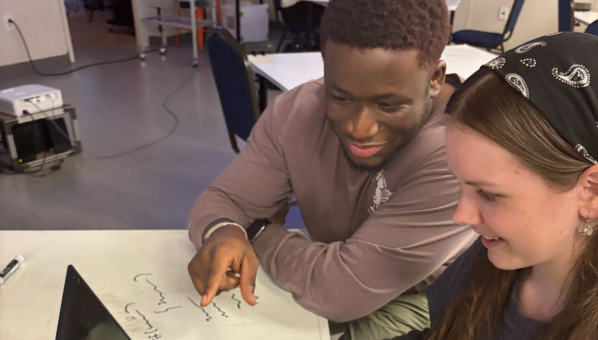 Sean-Anthony Mensah giving a poster presentation during his internship at Mohawk