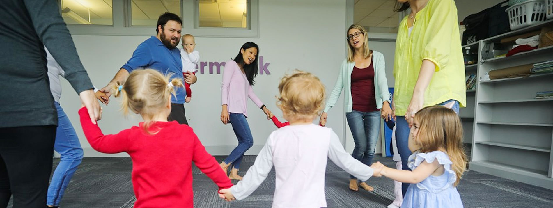 families holding hands in a circle